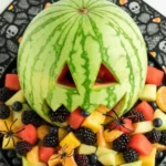 Delicious halloween appetizers laid out on a white marble table