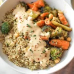A close-up of a plated vegan and gluten-free dinner, showcasing vibrant vegetables and plant-based protein.