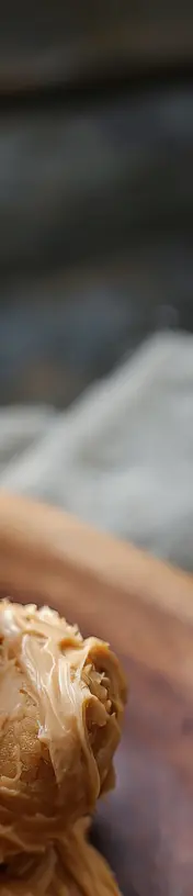 Golden stack of Japanese soufflé pancakes topped with fresh fruit and dusting of sugar.