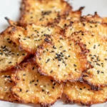 Delicious cottage cheese chips arranged neatly on a baking sheet, ready to eat.