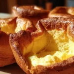 Golden, fluffy Yorkshire Puddings with deep, crispy edges.