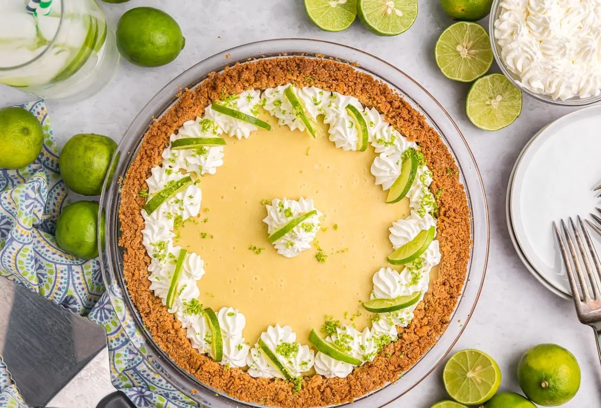 Key Lime Pie: The 4 Must-Know Secrets 2 A vibrant green key lime pie with whipped cream topping