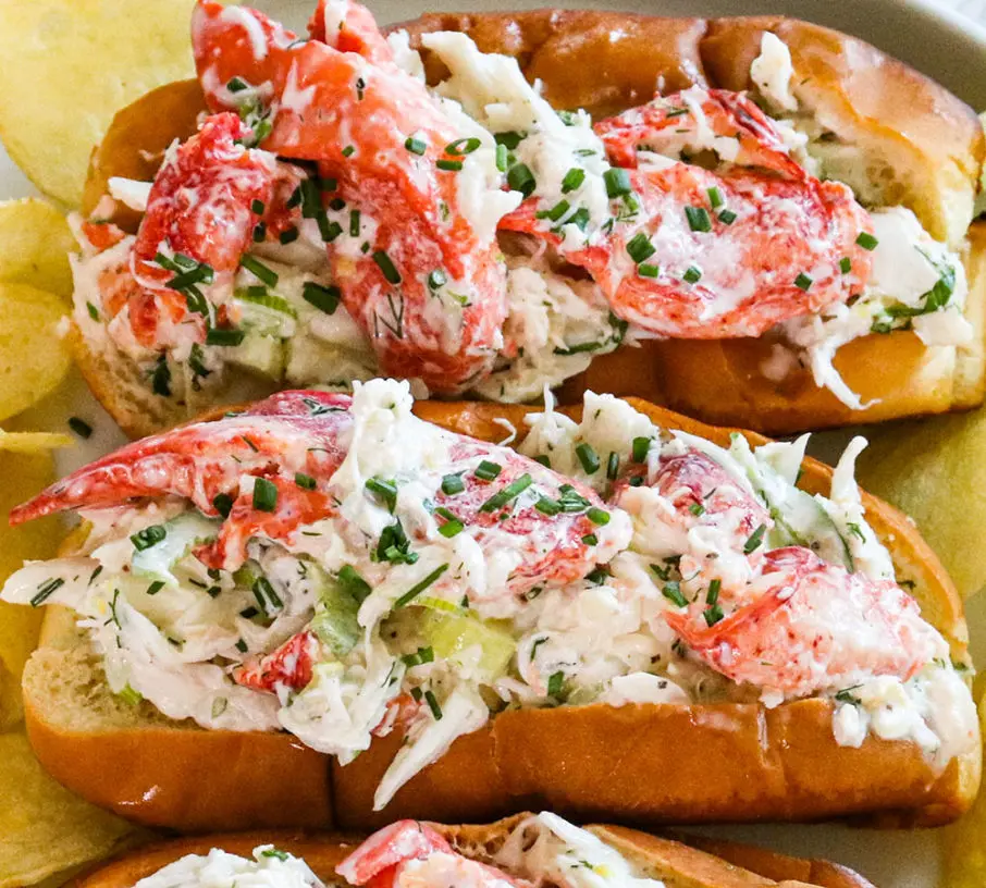 Maine crab roll: 7 reasons you need one now 2 A freshly prepared Maine crab roll on a toasted bun, garnished with a lemon wedge